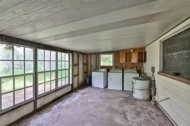 a view of a house with a yard porch and sitting area