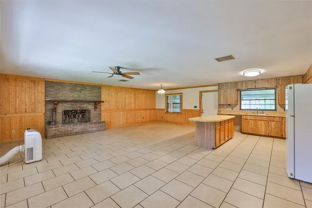 a view of a kitchen with furniture and a fireplace