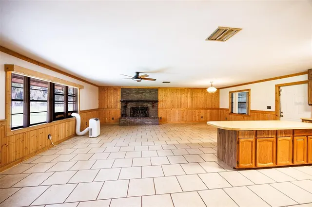 a view of a kitchen with furniture and a fireplace