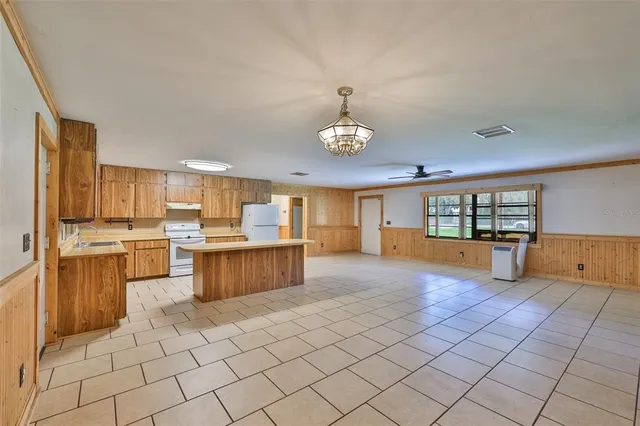 a kitchen with a sink counter top space and cabinets