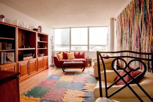 a reading room with furniture and a window
