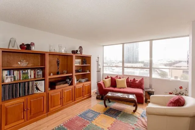 a reading room with furniture and a book shelf
