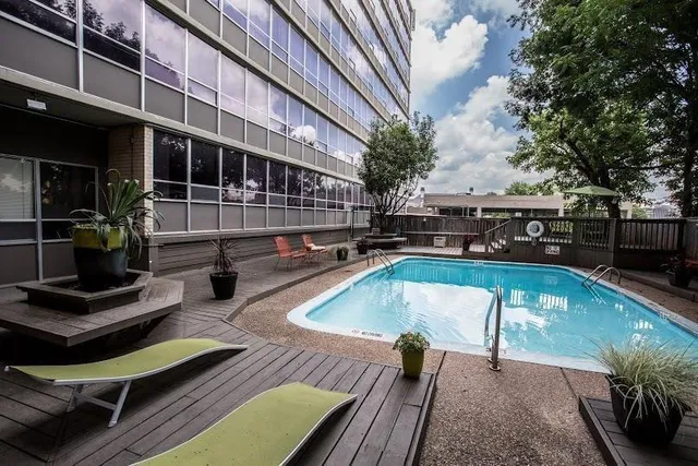 a view of a swimming pool with a patio