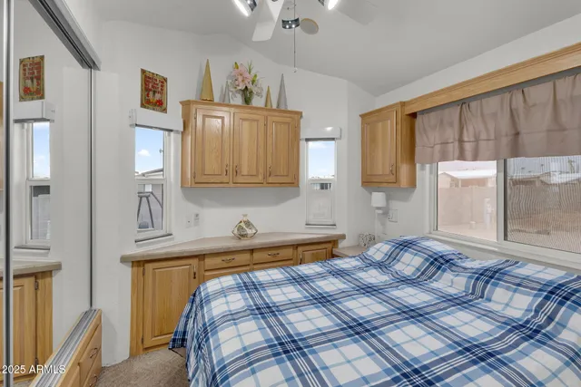 a bathroom with a shower and a glass door