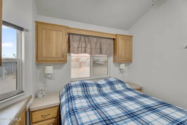 a bedroom with a bed and a cabinets