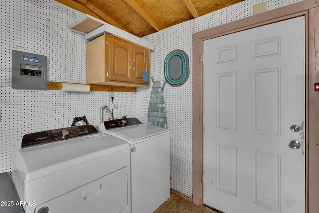 a bathroom with a sink vanity granite tub and a mirror