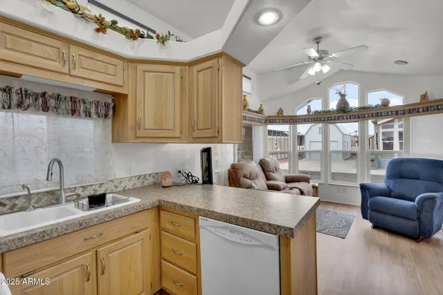 a kitchen with a sink and a refrigerator