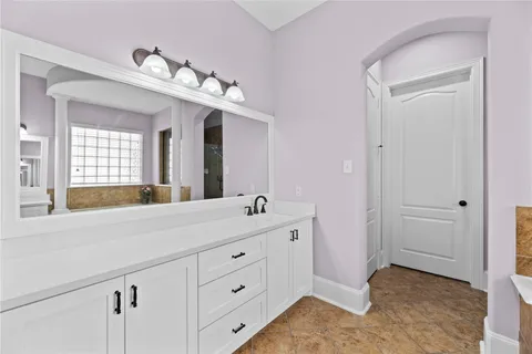 a bathroom with a tub and shower