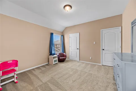 a view of a bathroom with a sink and a mirror