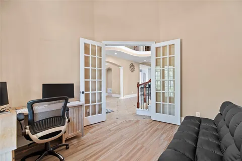 a view of livingroom with workspace and a window