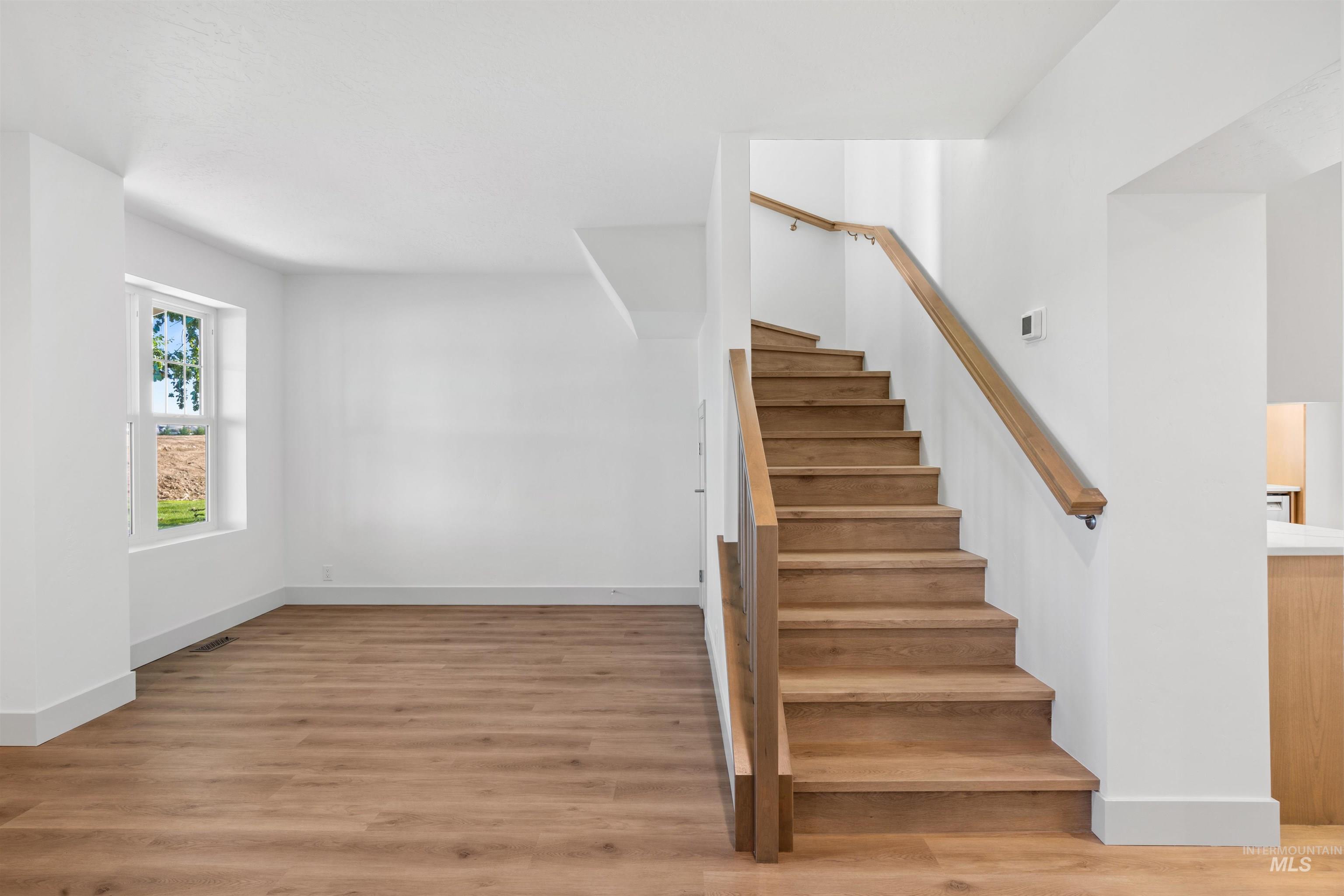 2141 West Beacon Light Road Eagle, ID 83616 - Photo 20 of 46 Staircase featuring wood finished floors
