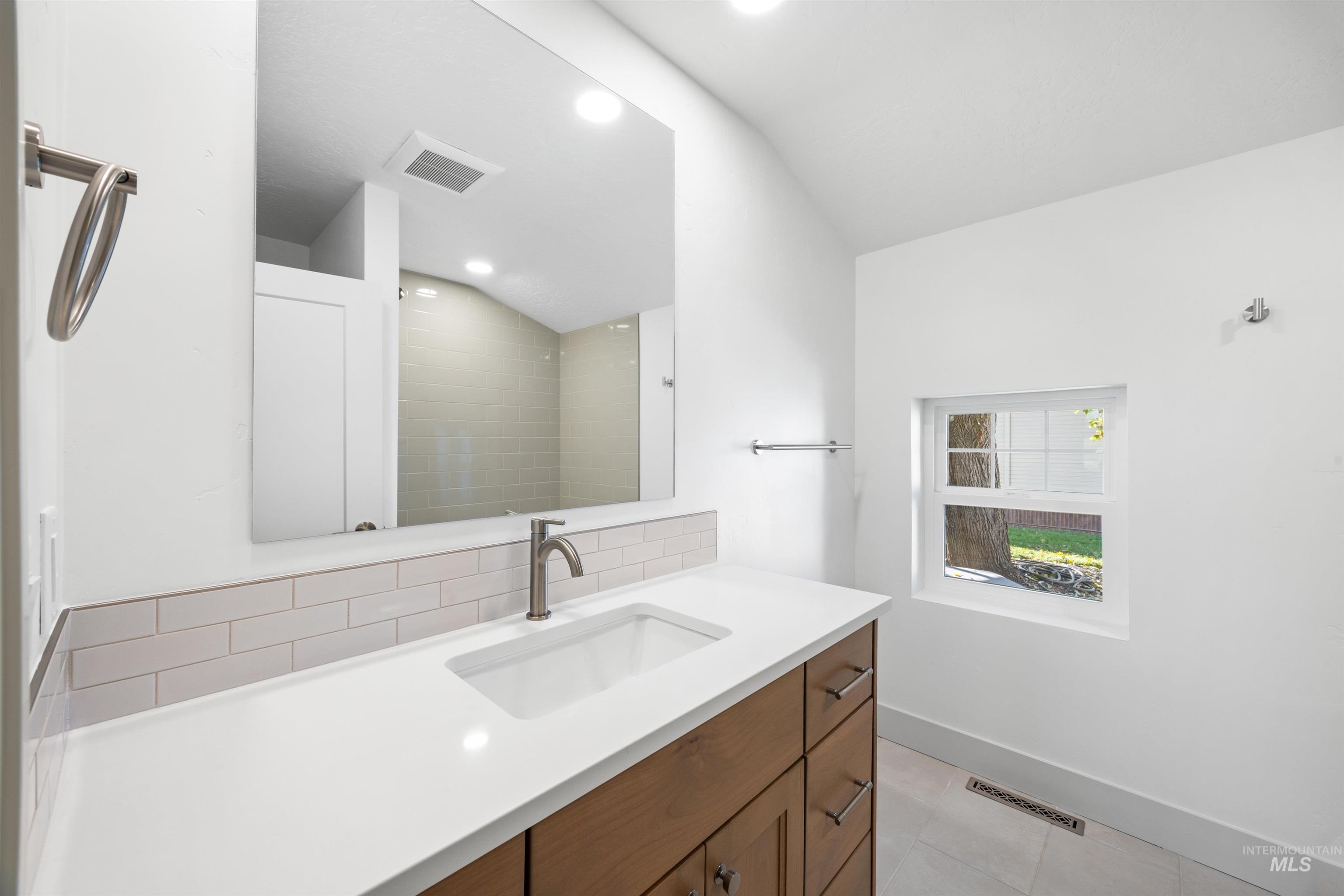2141 West Beacon Light Road Eagle, ID 83616 - Photo 21 of 46 Full bathroom with vanity and light tile patterned floors