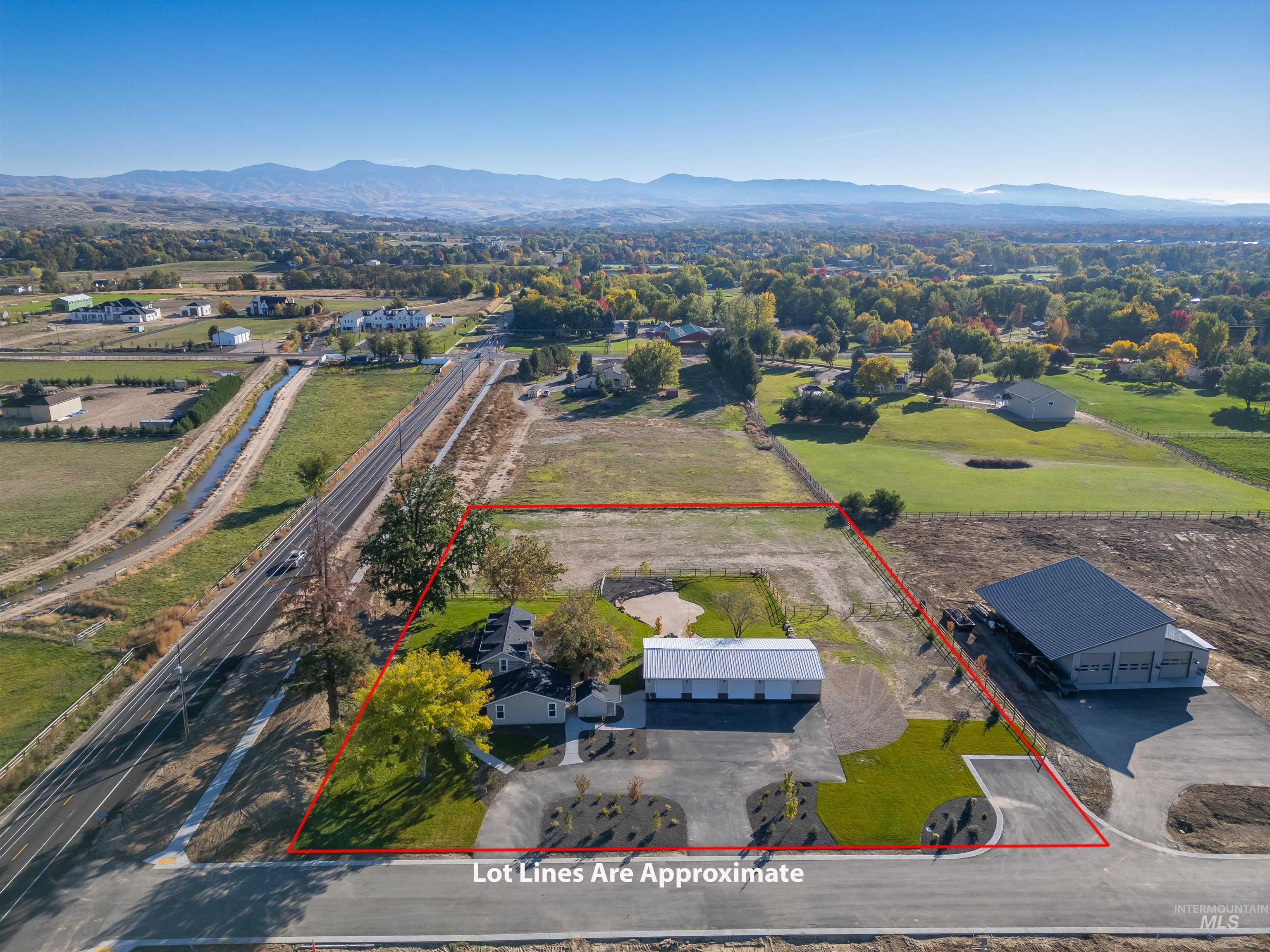 2141 West Beacon Light Road Eagle, ID 83616 - Photo 40 of 46 Aerial view of property's location with a mountain backdrop and property parcel outlined