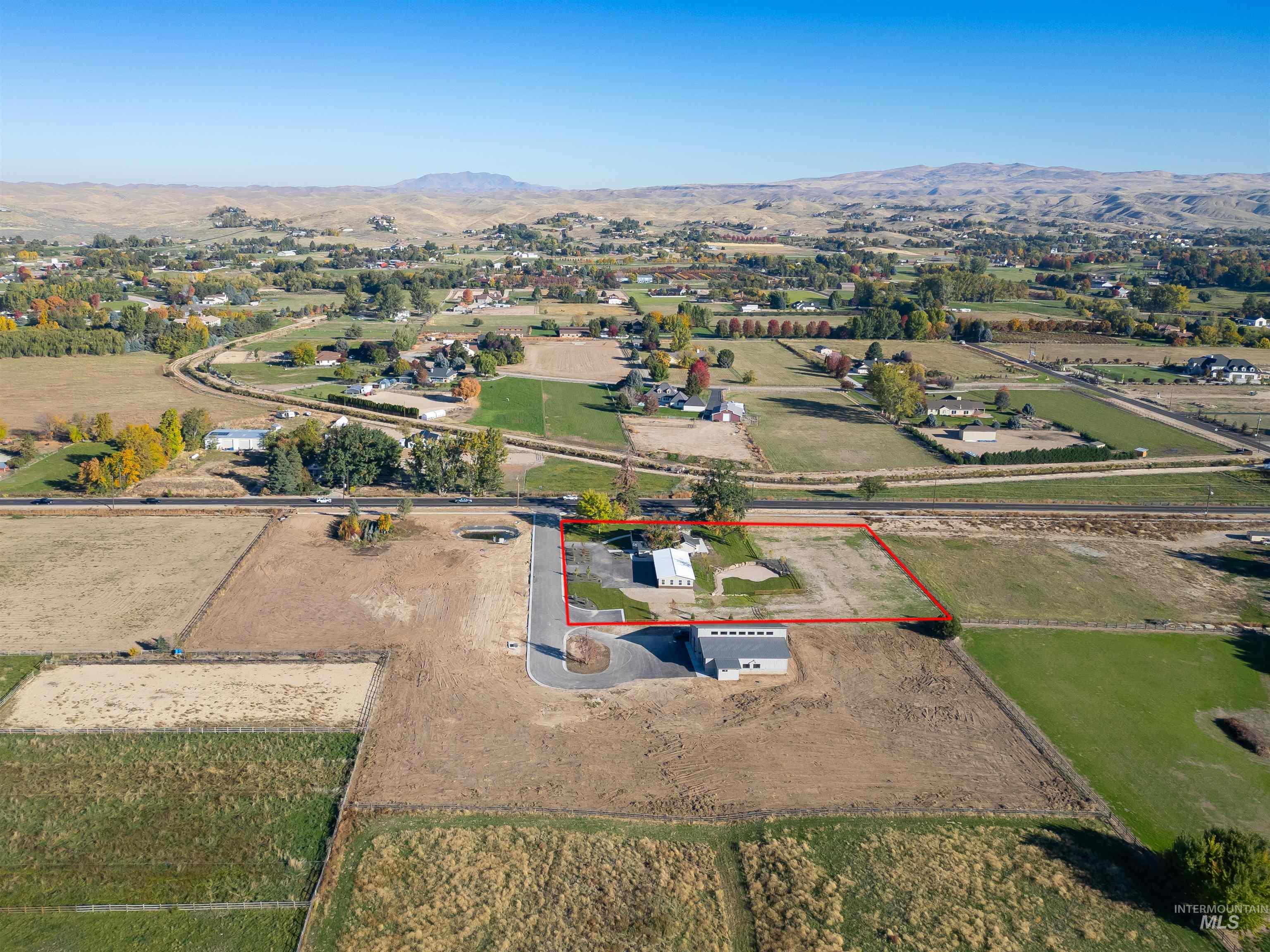 2141 West Beacon Light Road Eagle, ID 83616 - Photo 43 of 46 Aerial view of sparsely populated area featuring property boundaries highlighted and mountains