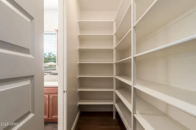 a kitchen with a sink a oven and a window