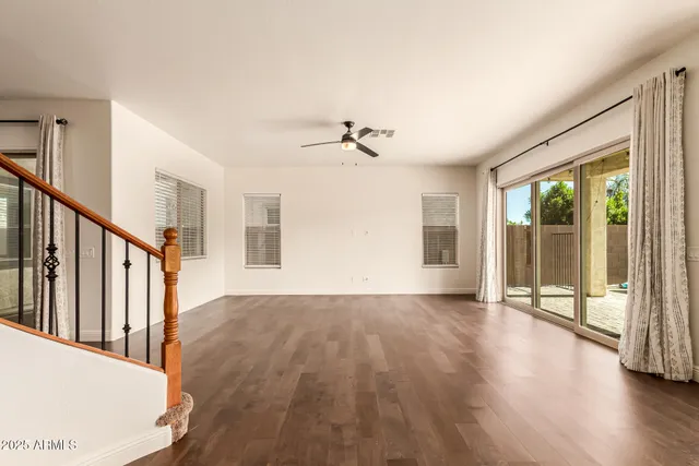 a view of an entryway with wooden floor