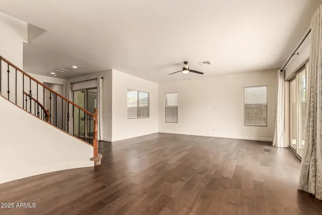 a view of an entryway with wooden floor and a window