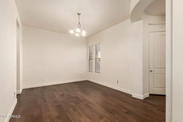 a view of a room with a large window and door