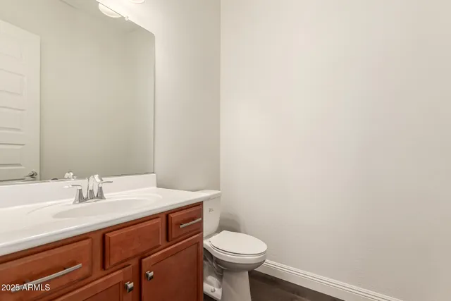 a spacious bathroom with a double vanity sink mirror and double