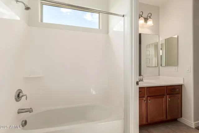 a view of a swimming pool with a lounge chairs