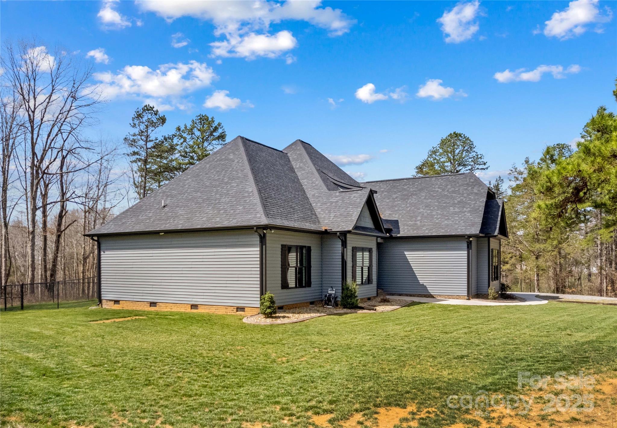 825 Potneck Road Salisbury, NC 28147 - Photo 3 of 40 a front view of a house with a garden