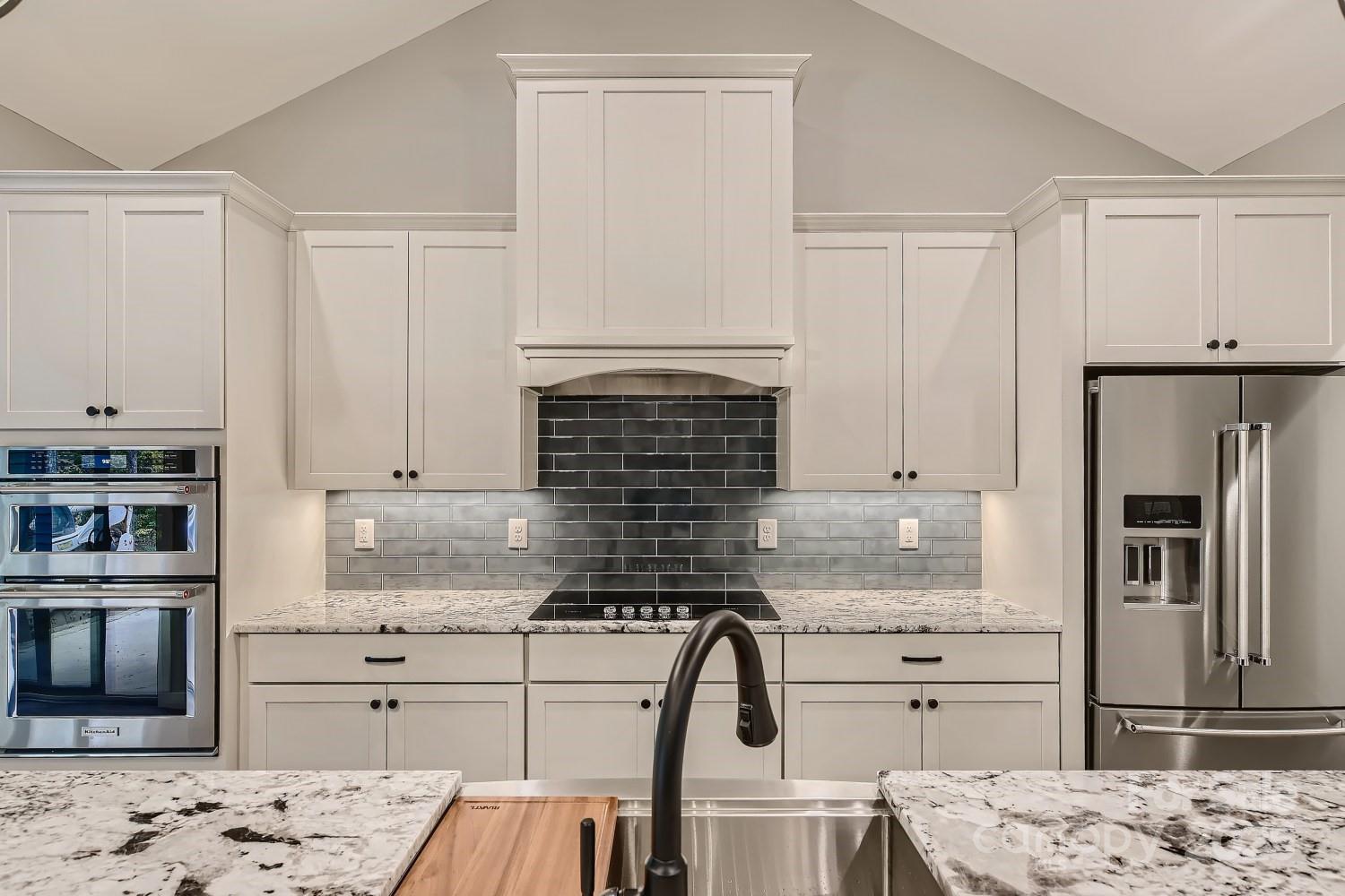 825 Potneck Road Salisbury, NC 28147 - Photo 7 of 40 a kitchen with kitchen island granite countertop cabinets and stainless steel appliances