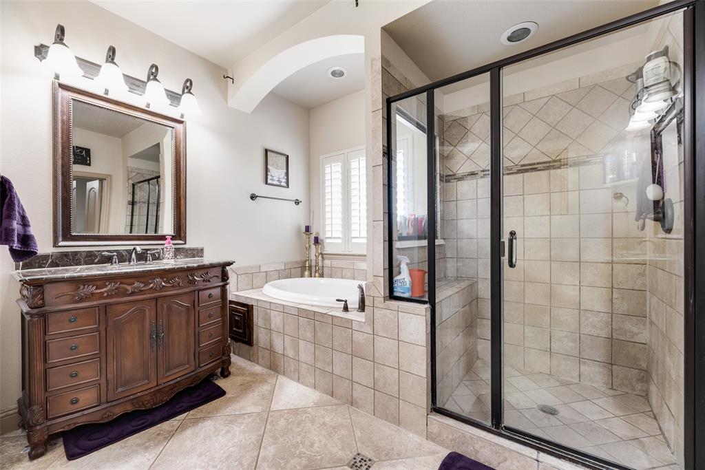 5056 Empire Way Irving, TX 75038 - Photo 24 of 39 Primary Bathroom #3 featuring tile patterned walk in shower