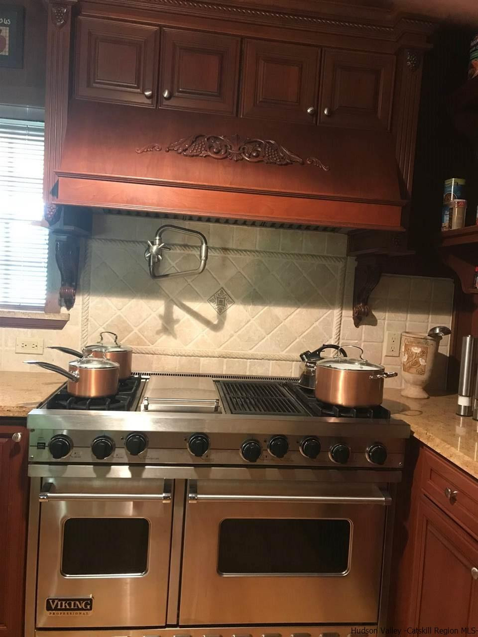 747 Sheldon Road Wallkill, NY 12589 - Photo 15 of 34 a stove top oven sitting inside of a kitchen
