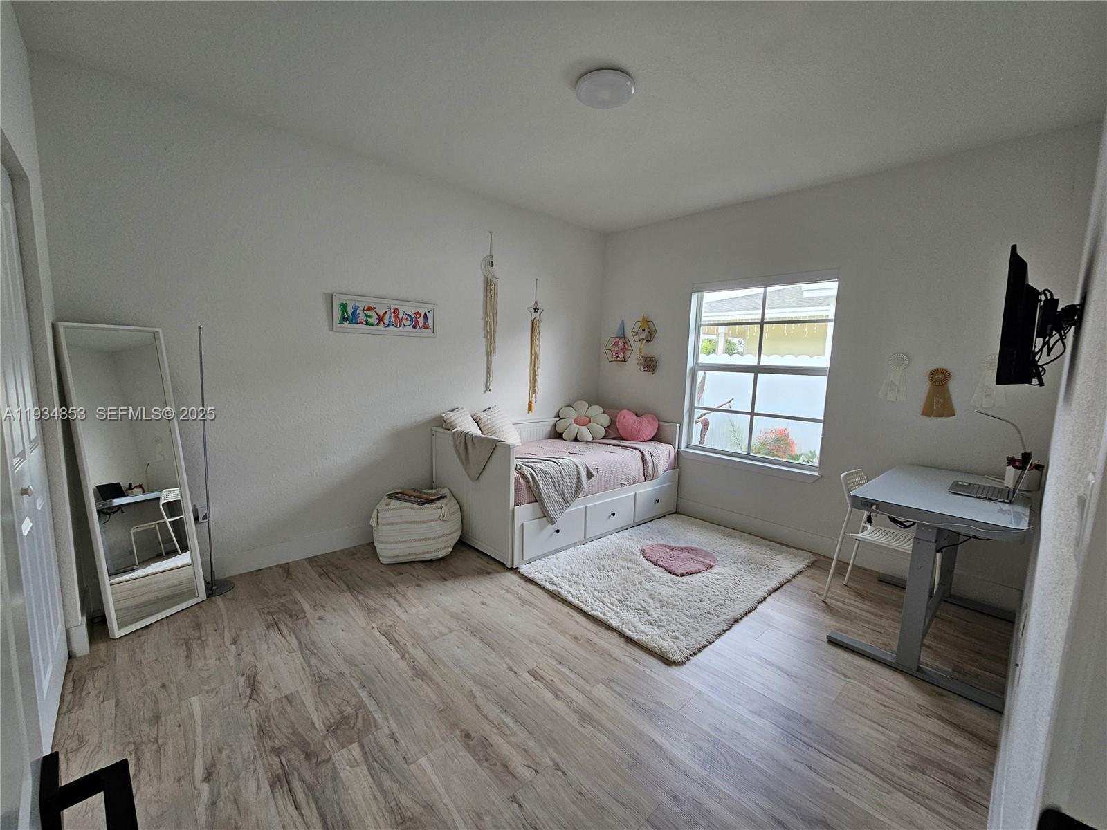 22155 Miami Avenue Miami, FL 33170 - Photo 16 of 23 a bedroom with furniture and a window