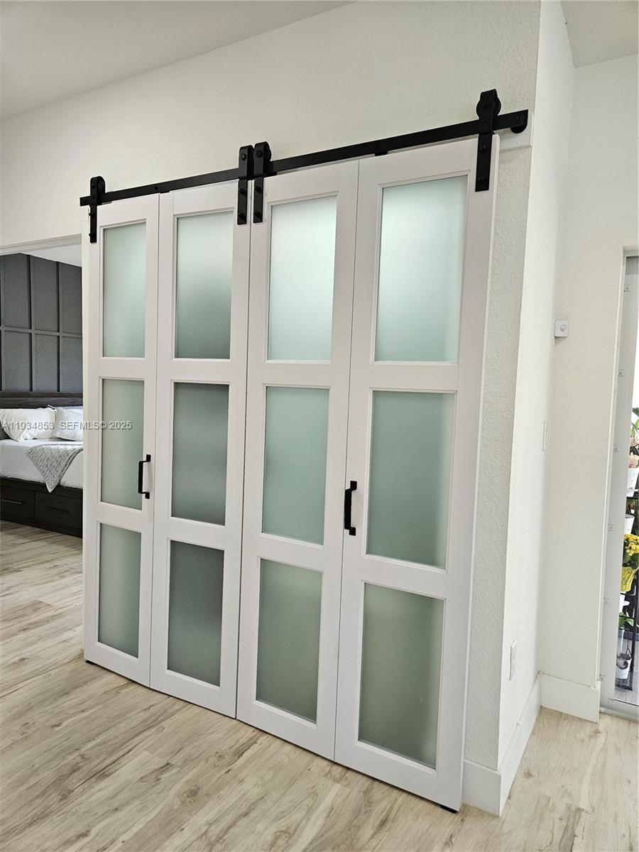 22155 Miami Avenue Miami, FL 33170 - Photo 9 of 23 a bathroom with a glass shower door