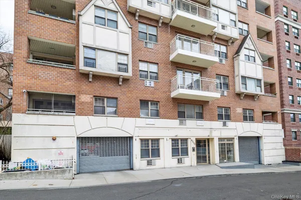 a front view of a building with a parking space