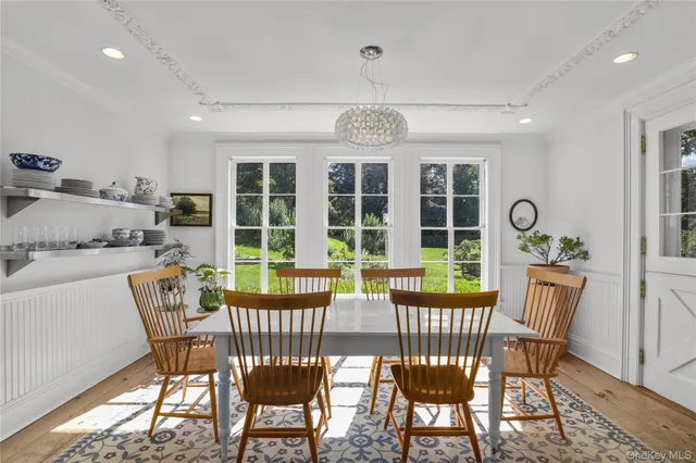 a view of a dining room with furniture window and outside view