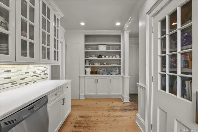 a view of storage and utility room with washer and dryer