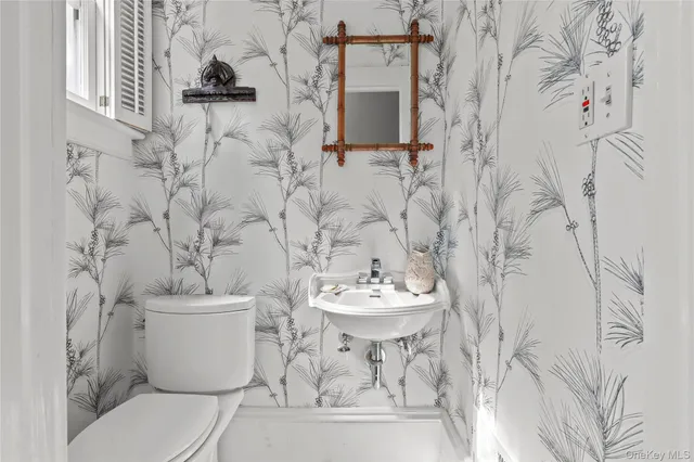 a bathroom with a toilet and a sink