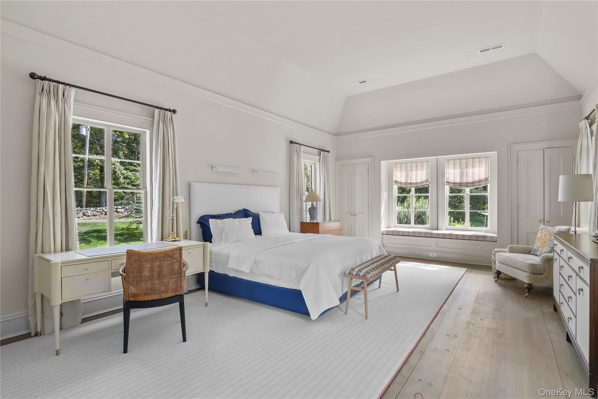 21 Katonahs Wood Road Katonah, NY 10536 - Photo 19 of 34 a spacious bedroom with a bed and a couch