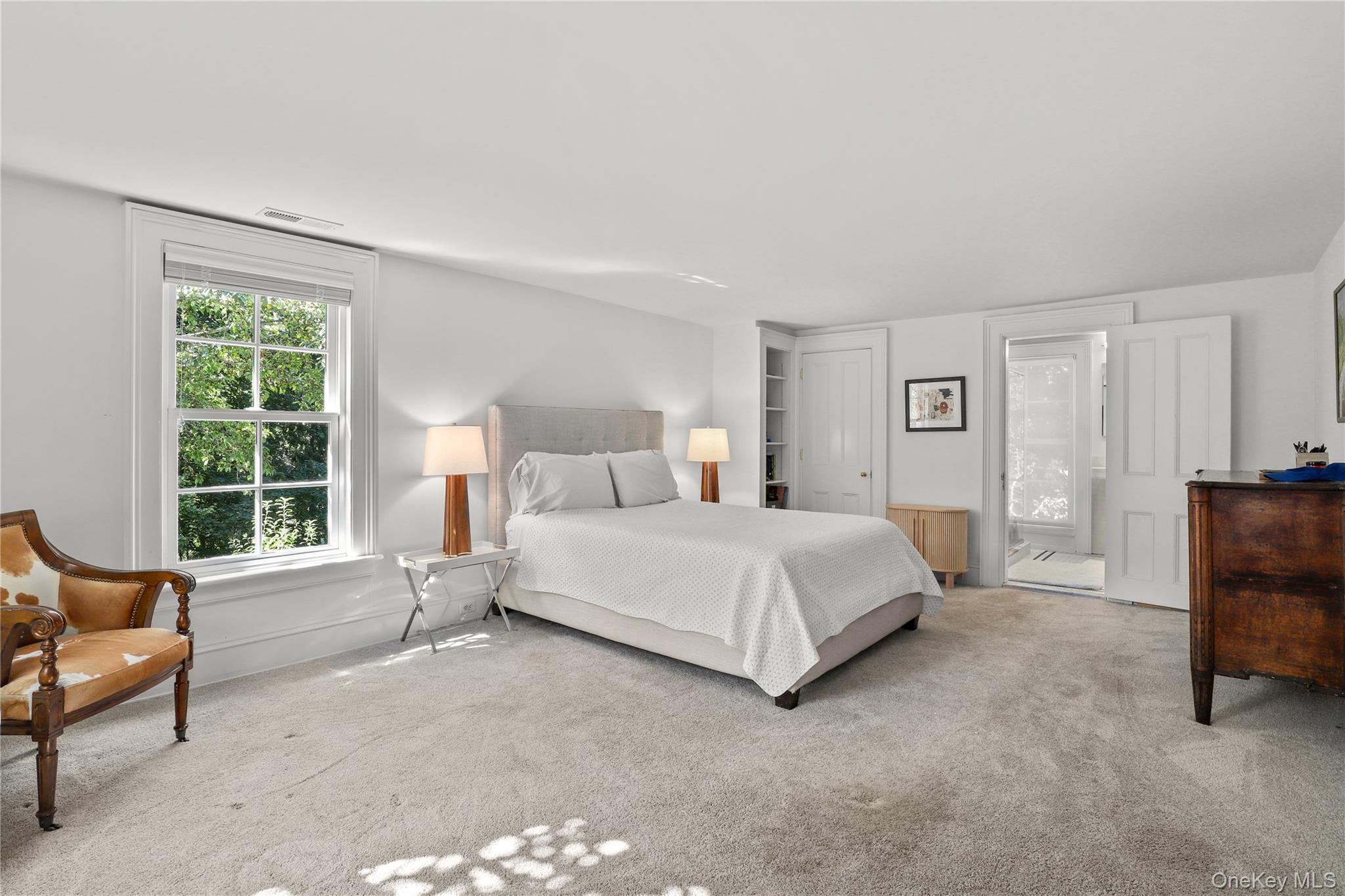 21 Katonahs Wood Road Katonah, NY 10536 - Photo 21 of 34 a bedroom with a bed and a couch