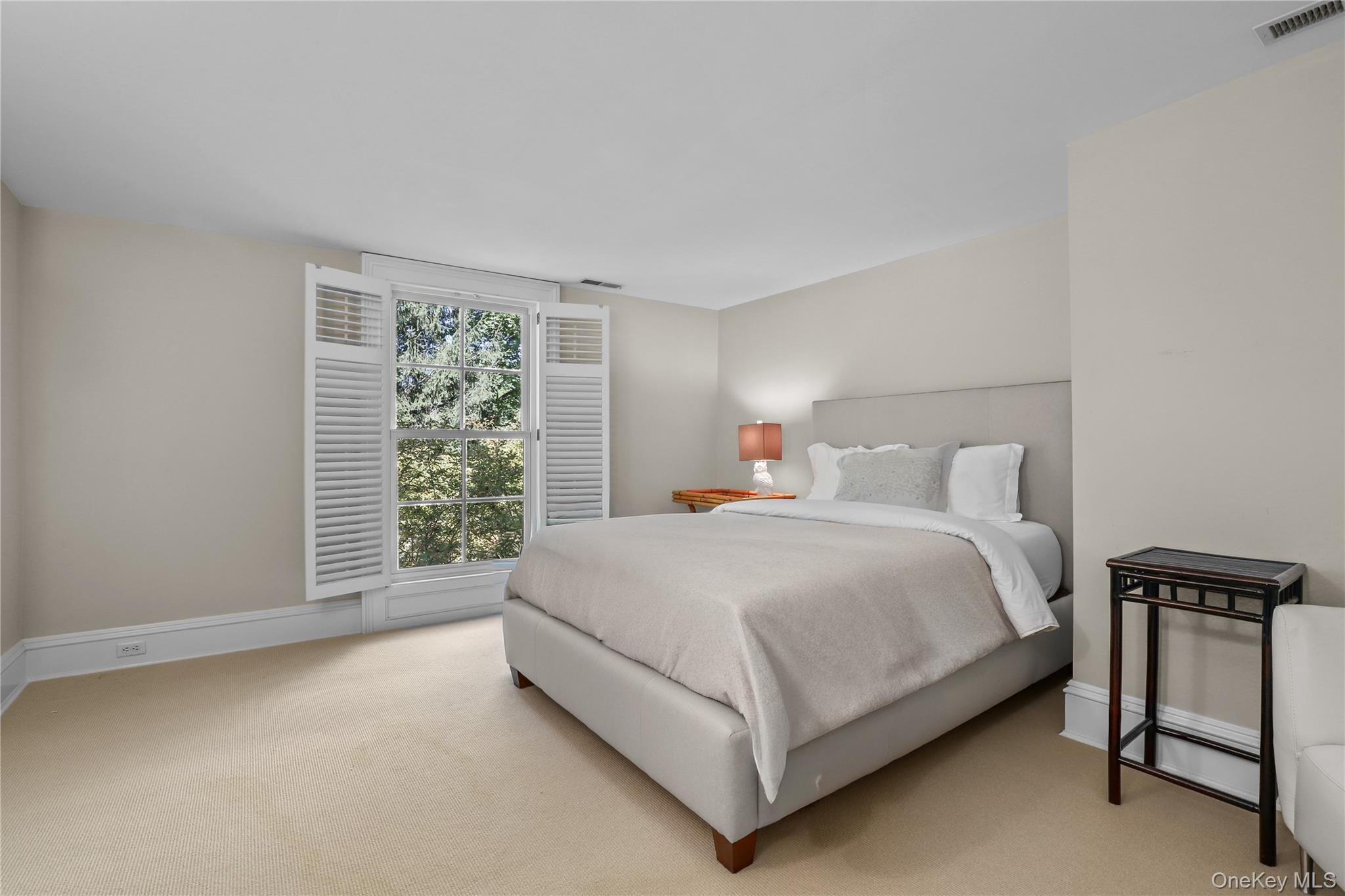 21 Katonahs Wood Road Katonah, NY 10536 - Photo 23 of 34 a bed sitting in a bedroom next to a window