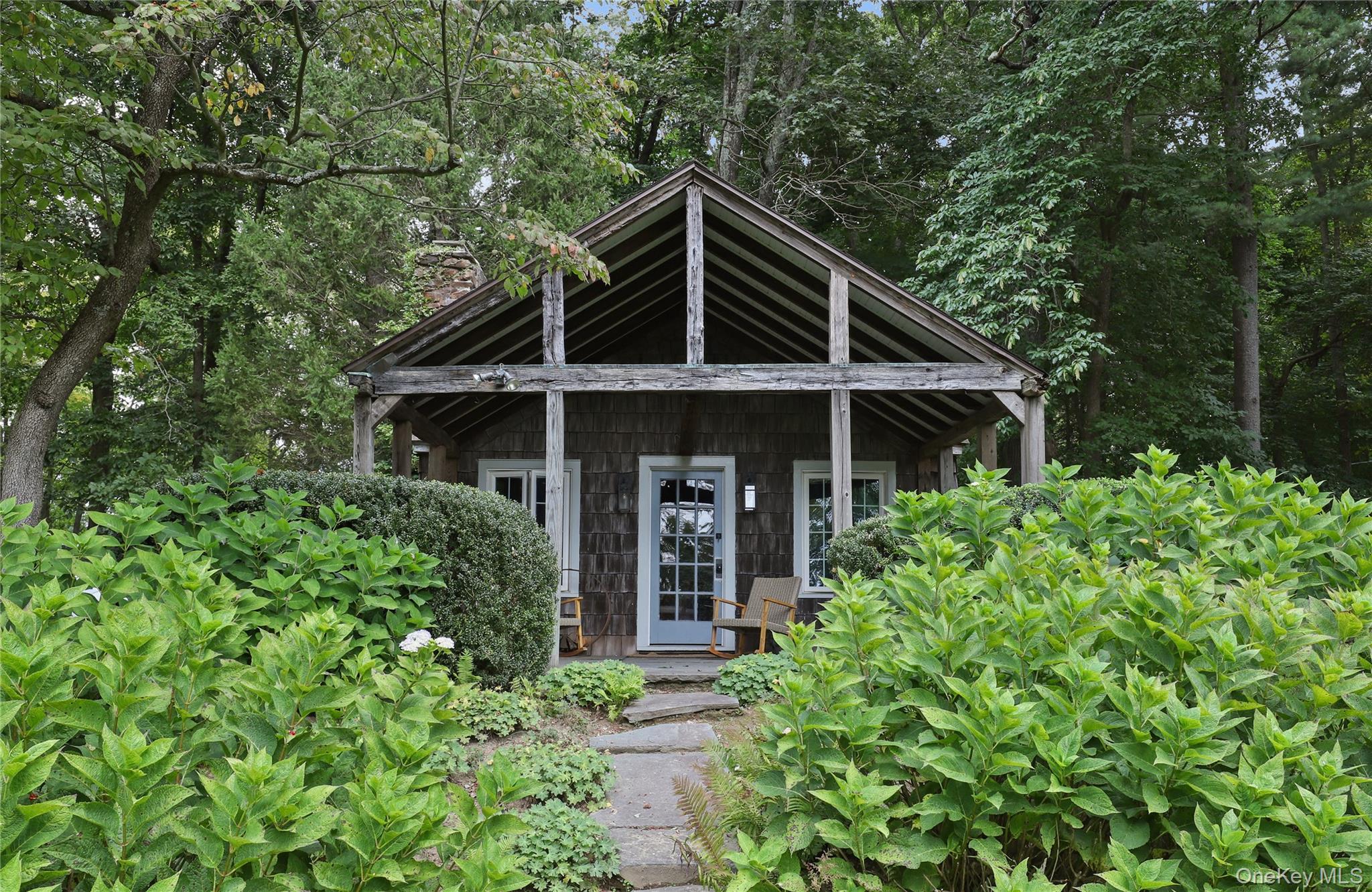 21 Katonahs Wood Road Katonah, NY 10536 - Photo 27 of 34 front view of a house with a yard