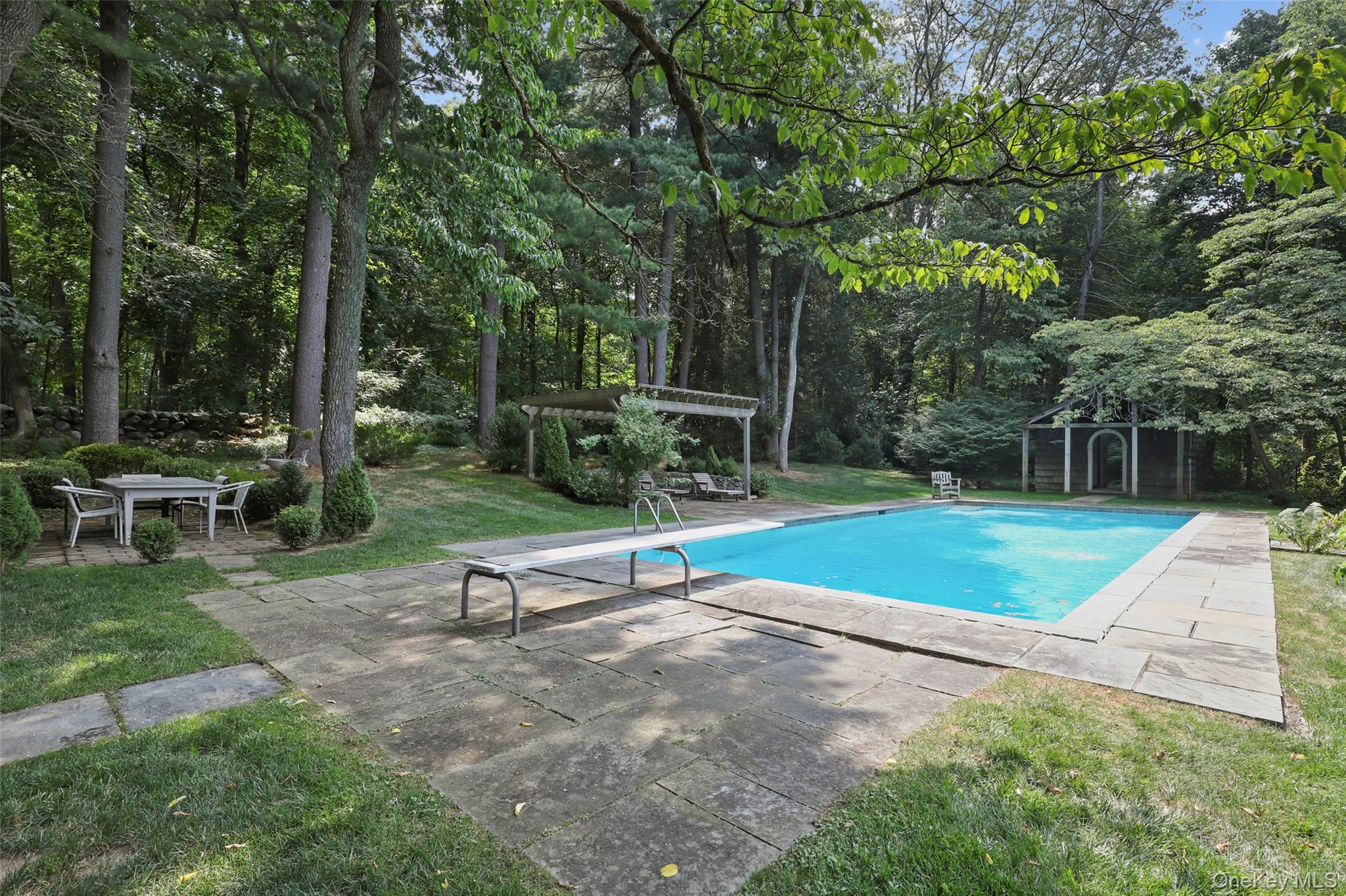 21 Katonahs Wood Road Katonah, NY 10536 - Photo 4 of 34 a park with bench and trees