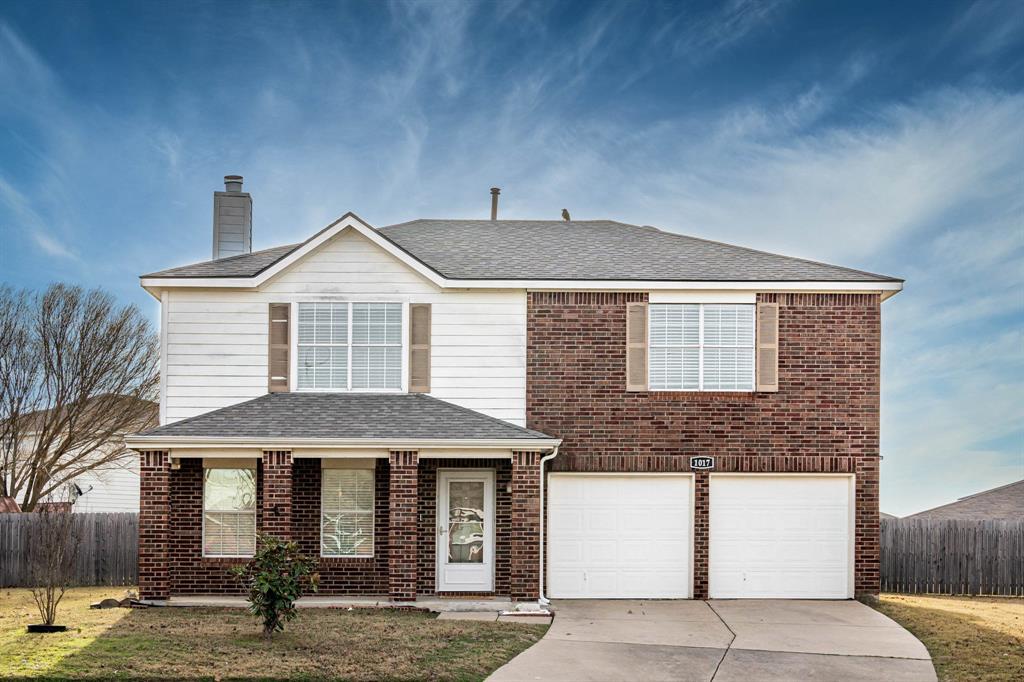 a front view of a house with garage