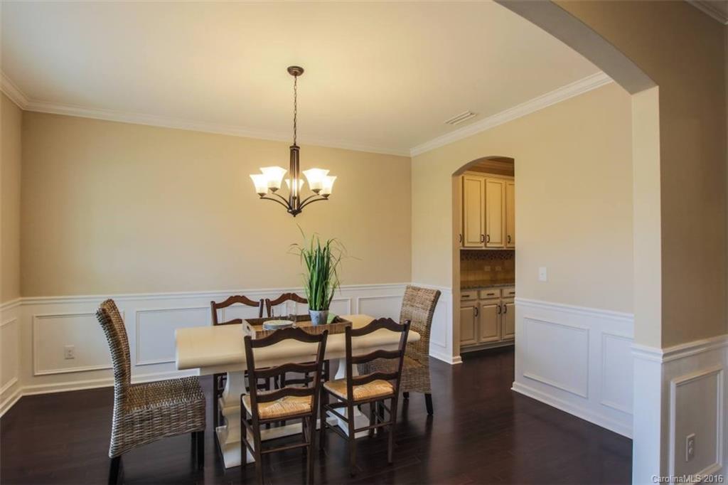3142 Amaranth Drive, Unit 481 Fort Mill, SC 29708 - Photo 6 of 24 a view of a dining room with furniture and wooden floor