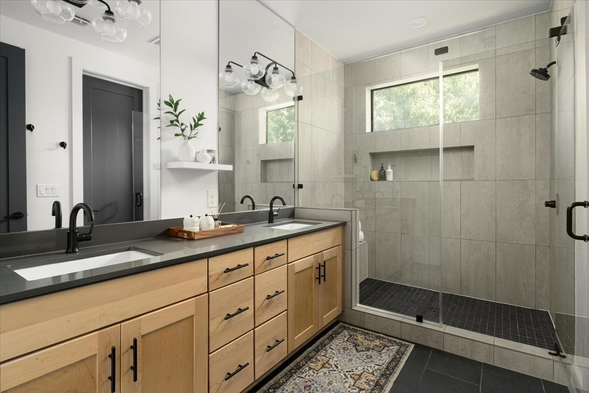 3700 Clawson Road, Unit 301 Austin, TX 78704 - Photo 21 of 35 Primary bathroom featuring double vanity and a oversized shower with built-ins