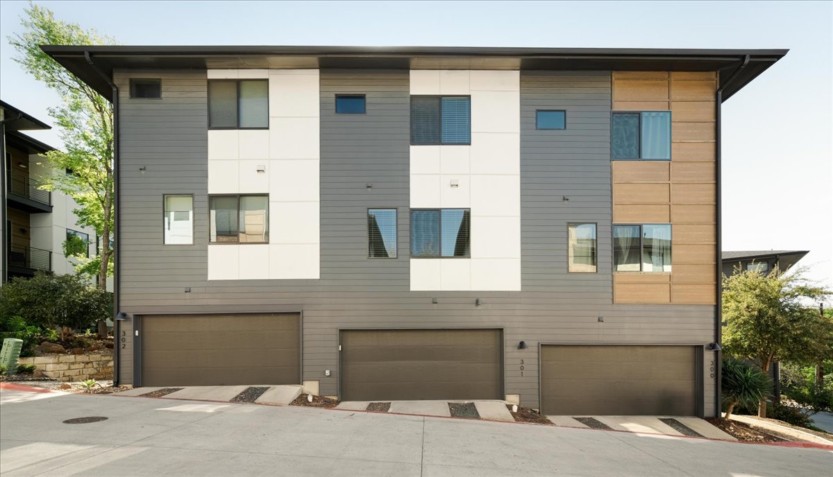 3700 Clawson Road, Unit 301 Austin, TX 78704 - Photo 28 of 35 Rear view of property featuring an attached garage