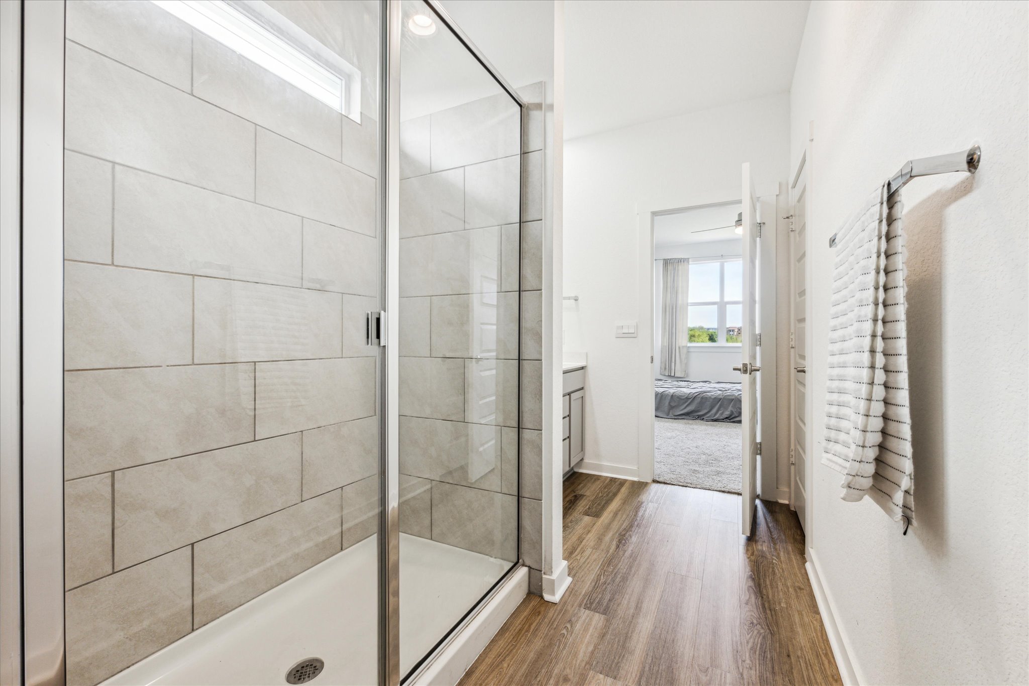 7916 Linnie Lane Austin, TX 78724 - Photo 12 of 14 a bathroom with a glass shower door