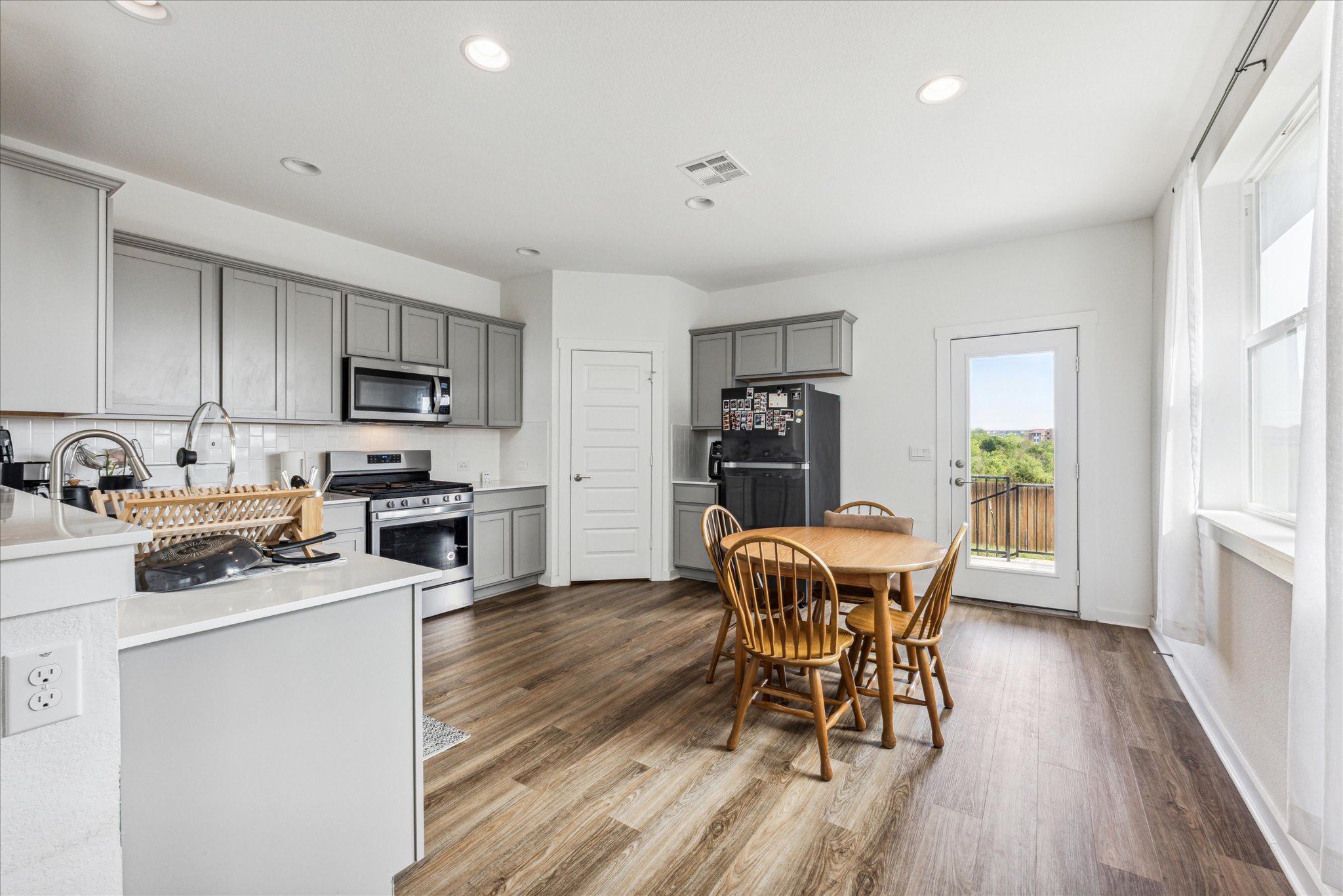 7916 Linnie Lane Austin, TX 78724 - Photo 5 of 14 a dining room with furniture and wooden floor