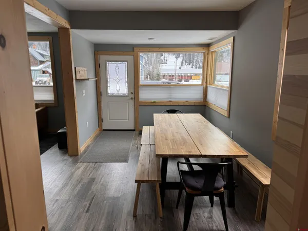 a dining room with furniture and window
