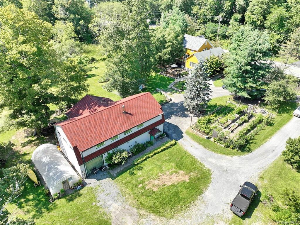 Aerial view of 3+ acres, house, Studio, greenhouse, organic garden