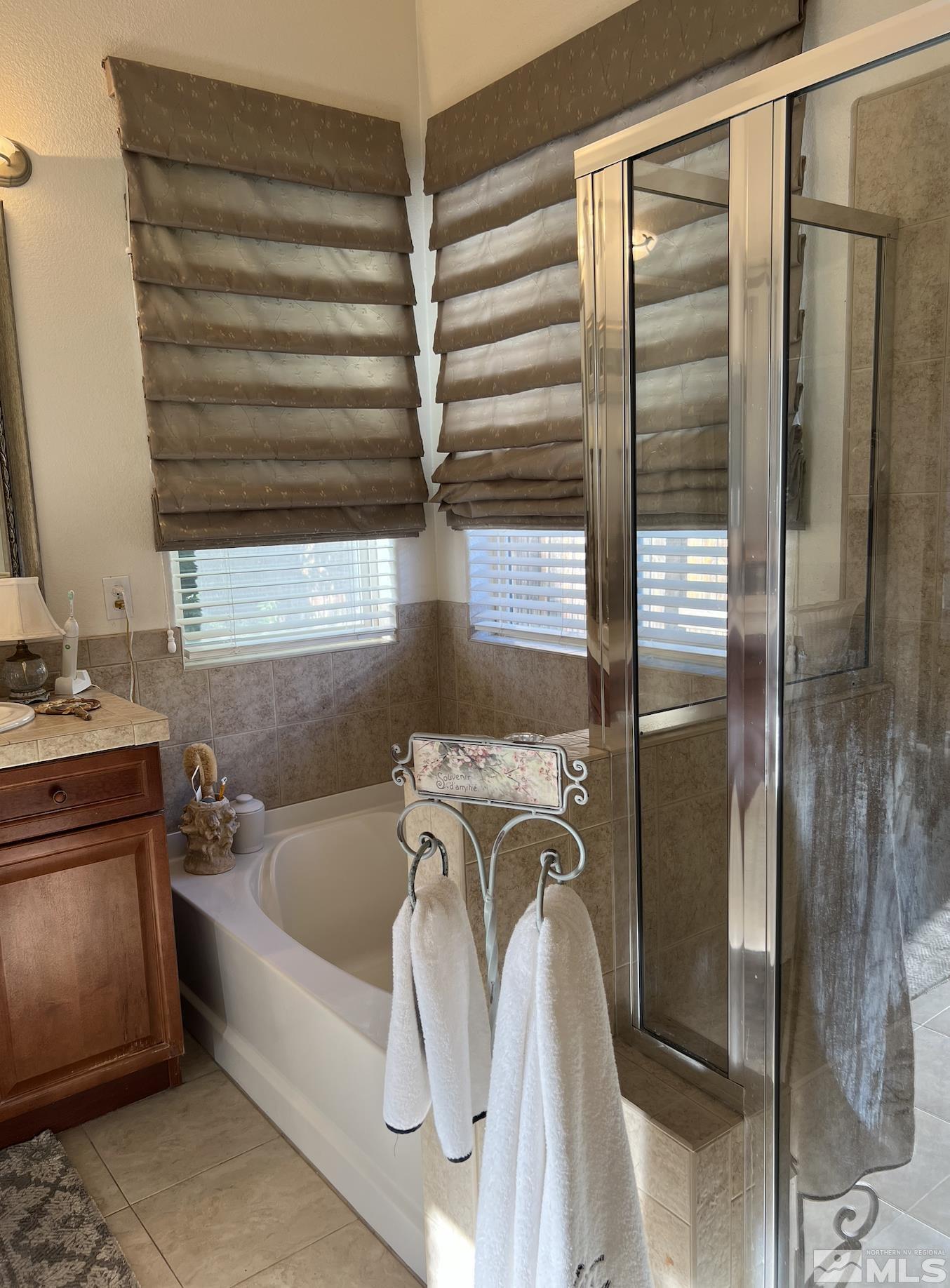 1885 Beringer Way Reno, NV 89521 - Photo 17 of 29 a bathroom with a bathtub and a shower