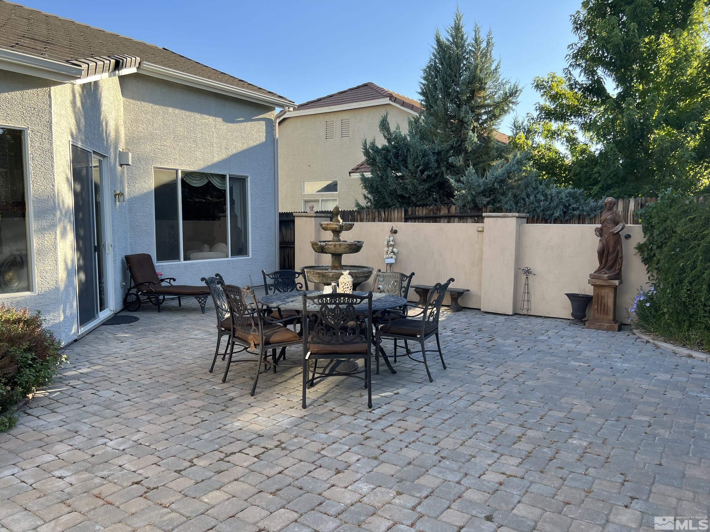 1885 Beringer Way Reno, NV 89521 - Photo 23 of 29 a view of a patio with table and chairs