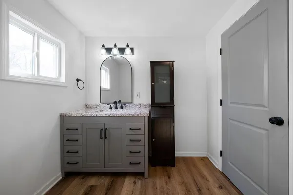 a bathroom with a sink and a mirror
